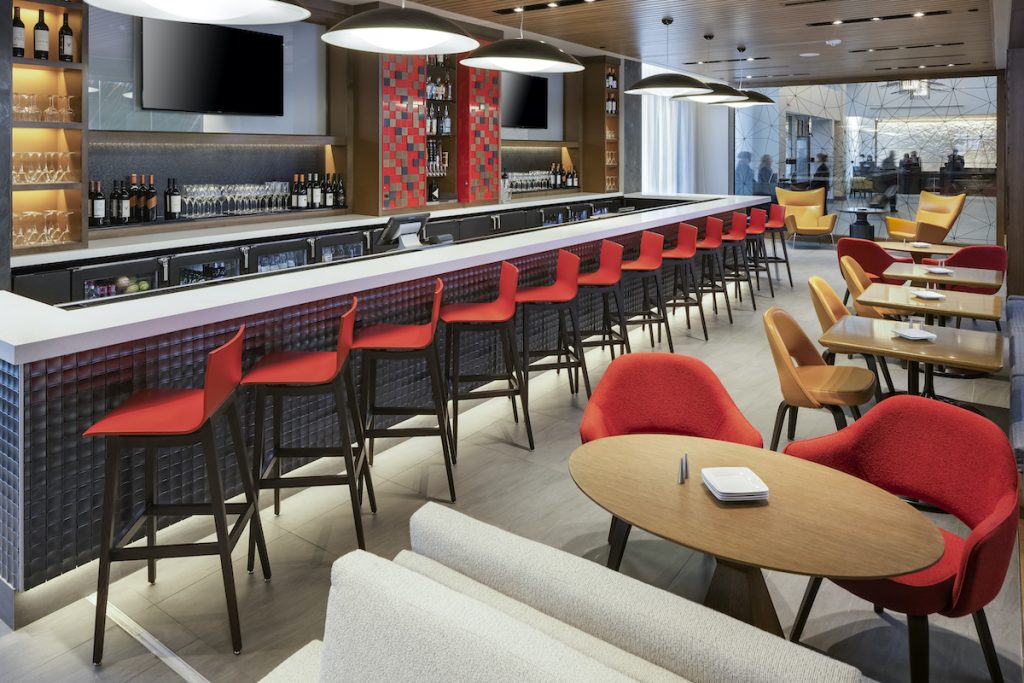 Modern hotel restaurant bar with red bar chairs
