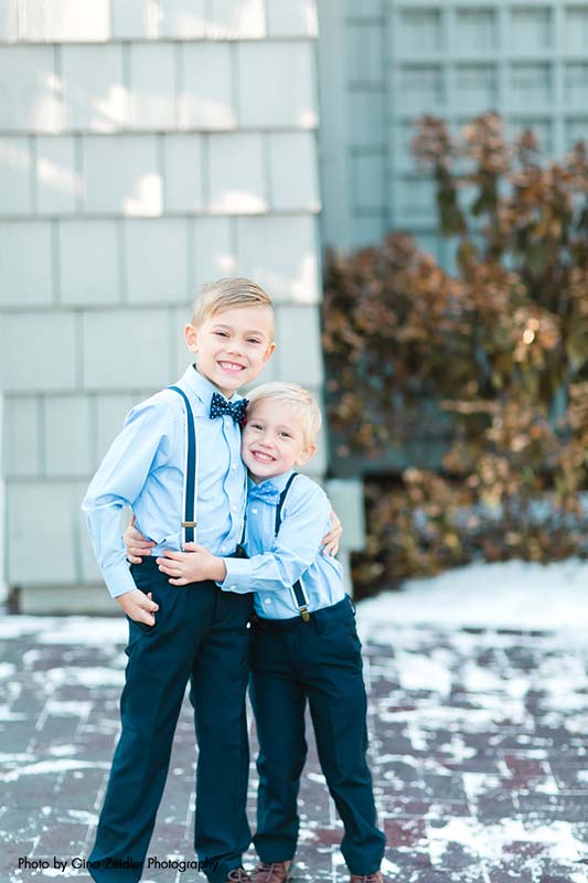 Ring bearers in blue shirts and black suspenders
