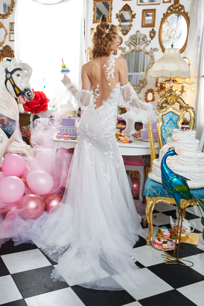 Strapless sweetheart stretch trumpet gown with scattered floral appliques, low illusion V back and detachable double balloon sleeve and godet skirt