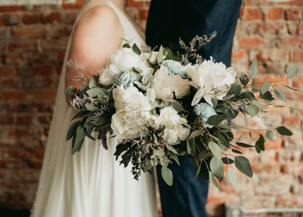 Greenery bridal bouquet with eucalyptus, white peonies, and  blue roses