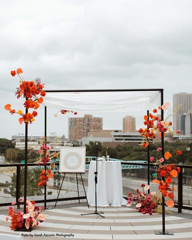 Colorful summer rooftop wedding ceremony