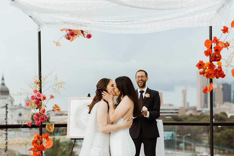 Brides first kiss at summer Minneapolis wedding