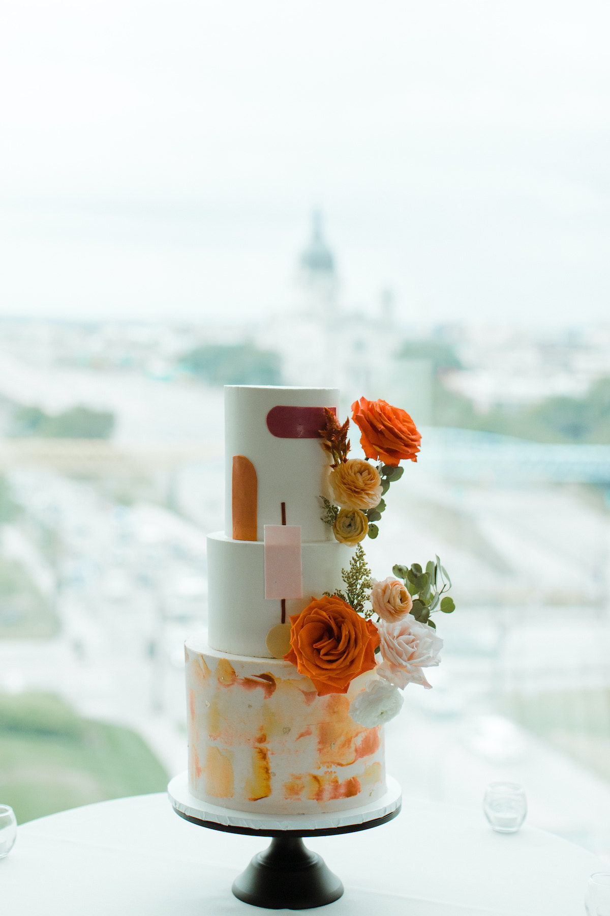 3-tier wedding cake with bright fresh flowers