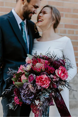 Red and deep purple moody bridal bouquet by Rison Design