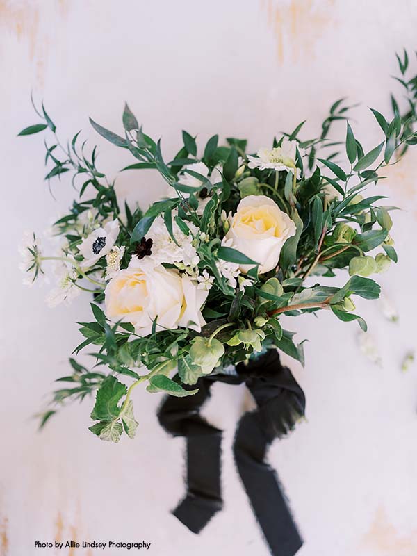 Bridesmaids bouquet with white roses and greenery