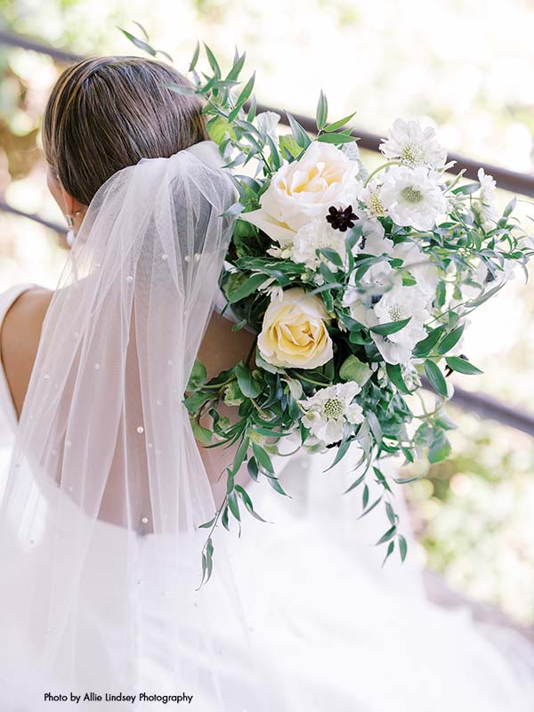 Bride holds modern bouquet