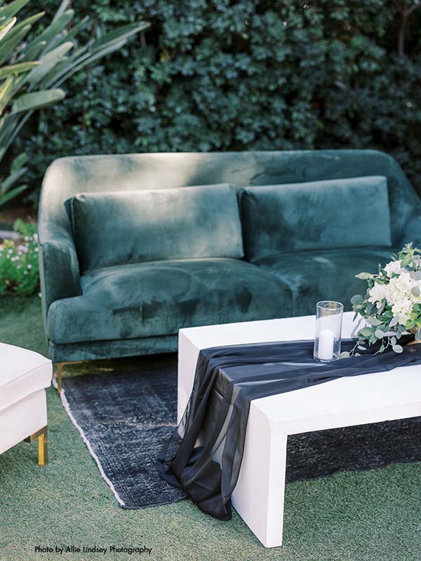 Wedding lounge with a green velvet settee