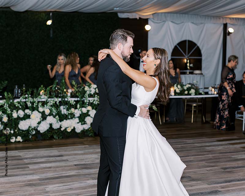 Bride and groom share first dance during wedding reception