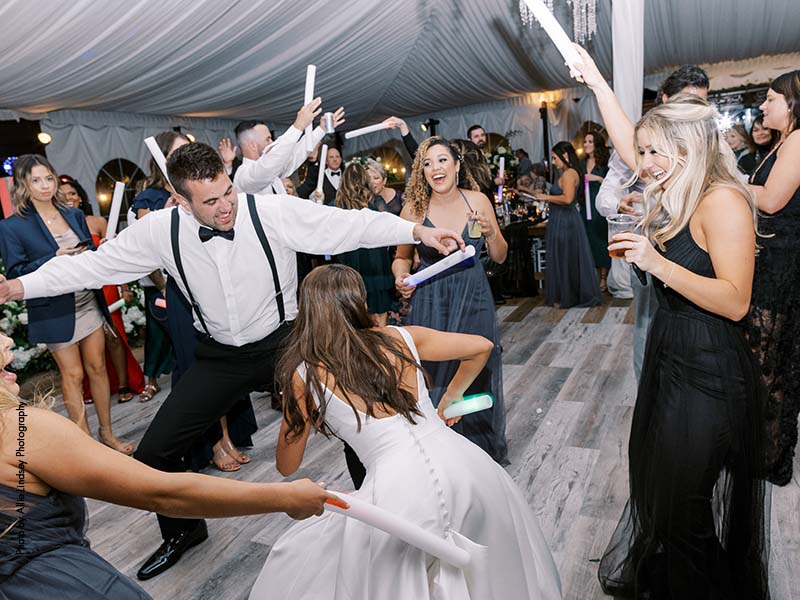 Bride dances with friends during wedding reception