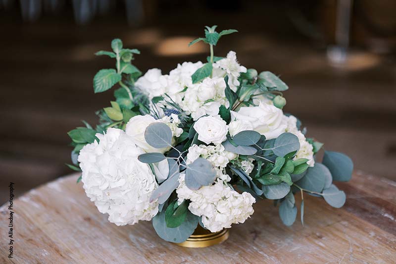Wedding centerpiece with white hydrangea and eucalyptus