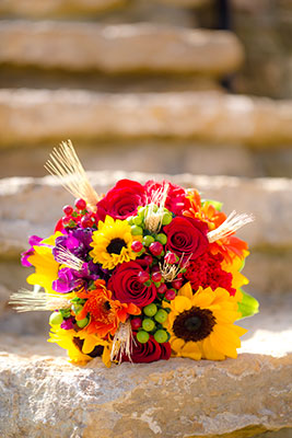 Round fall bridal bouquet with sunflowers by Renning's Floral