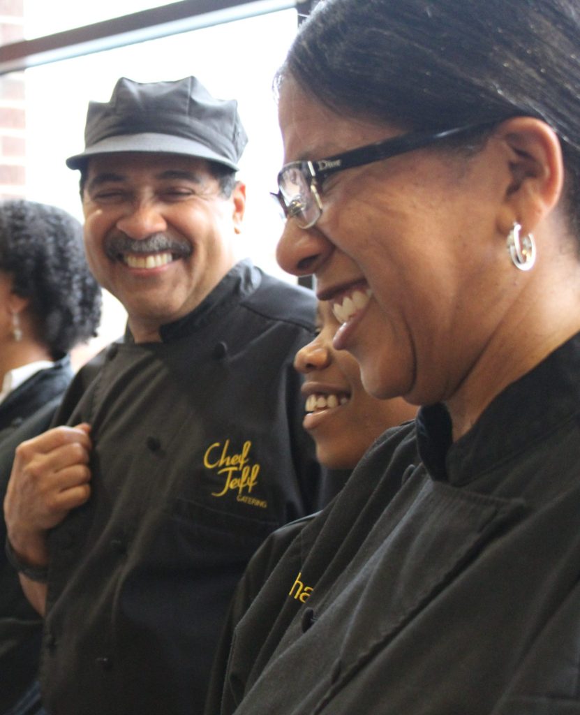 Members of Chef Jeff Catering in black chef's coats