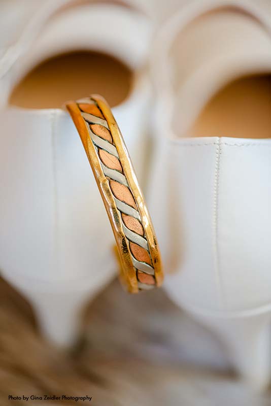 Gold wedding band with rose gold swirl