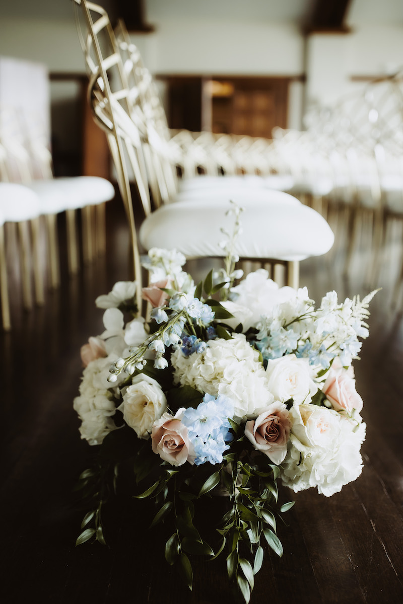 Pastel flowers for ceremony aisle