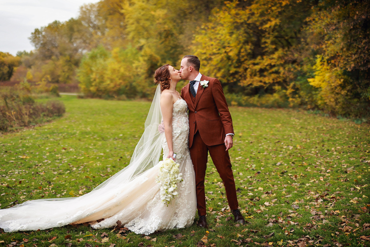Bride and groom outside at romantic autumn wedding