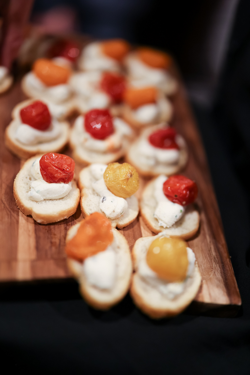 Crostini topped with whipped ricotta and tomato