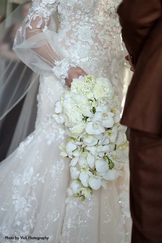 Cascading bridal bouquet with orchids and hydrangea