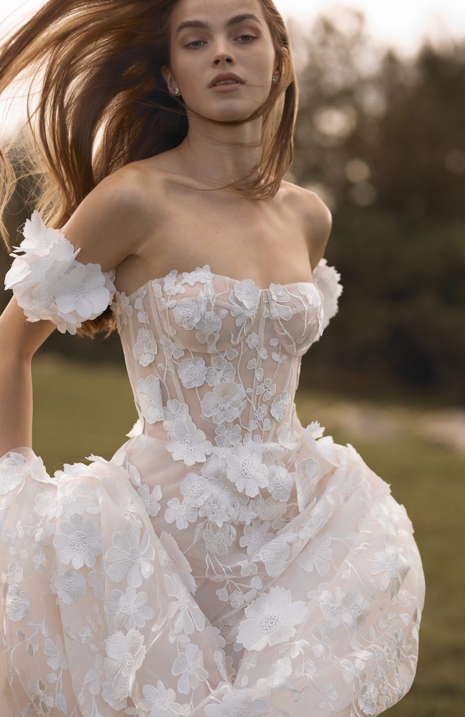 A-line bridal gown with nude underlay and 3D floral
